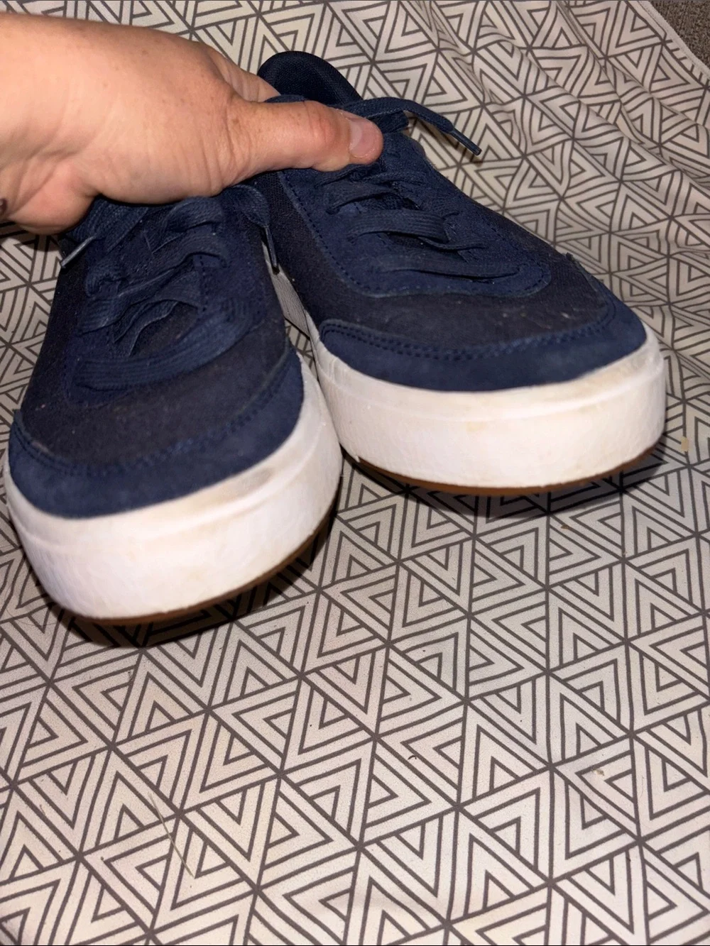 Navy Low-Top Canvas Sneakers with White Sole slide on.